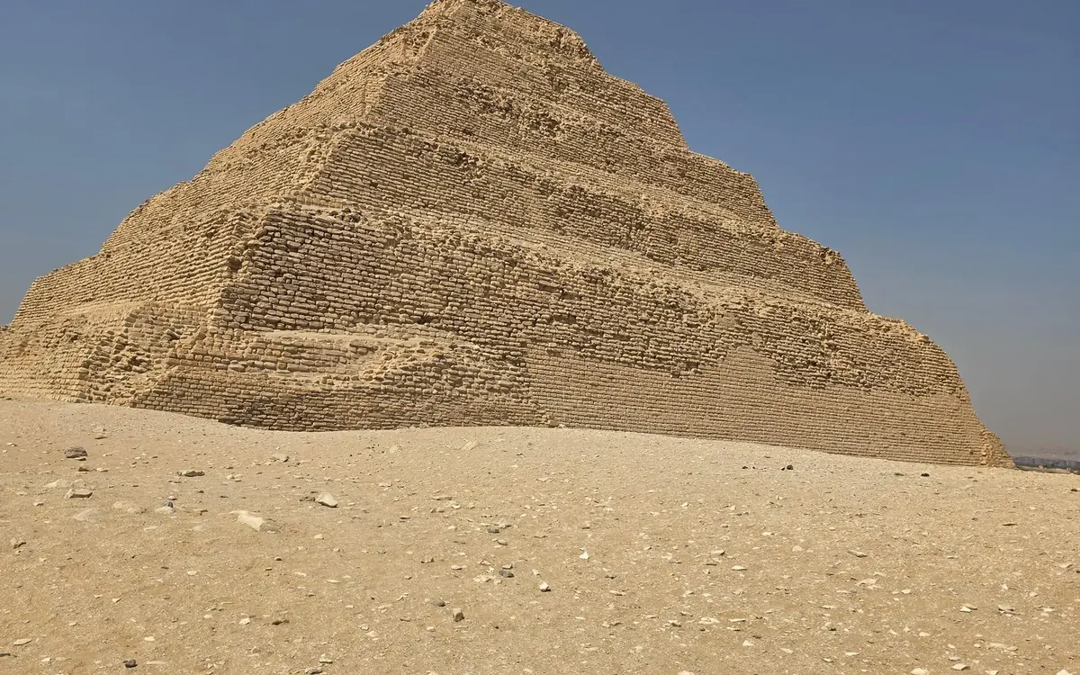 The Great Sphinx of Giza with the pyramids behind it on a clear day