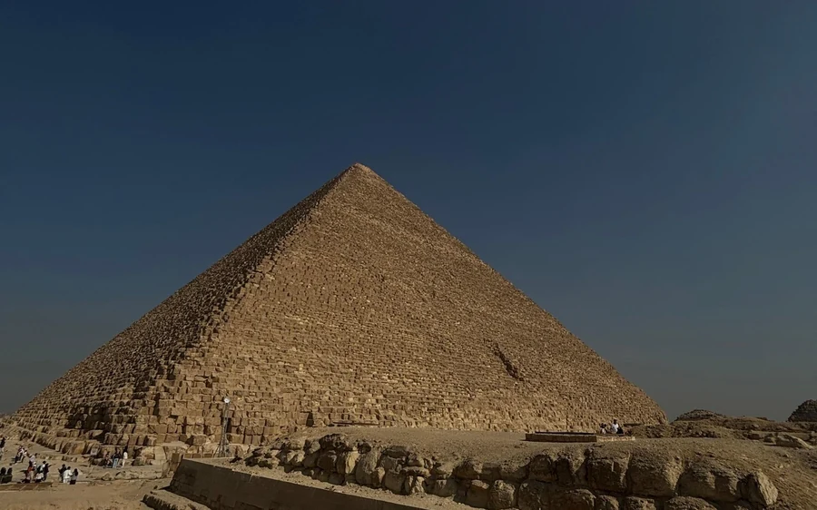 A guide explaining the Great Sphinx of Giza to visitors